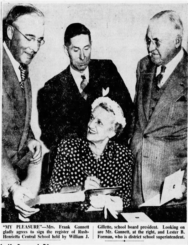 Board members in 1952 around a desk.